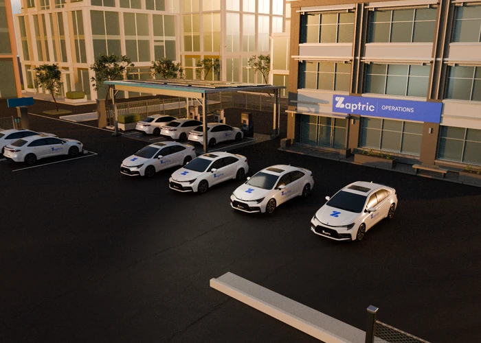 A group of branded illustrative fleet vehicles organised around the depot